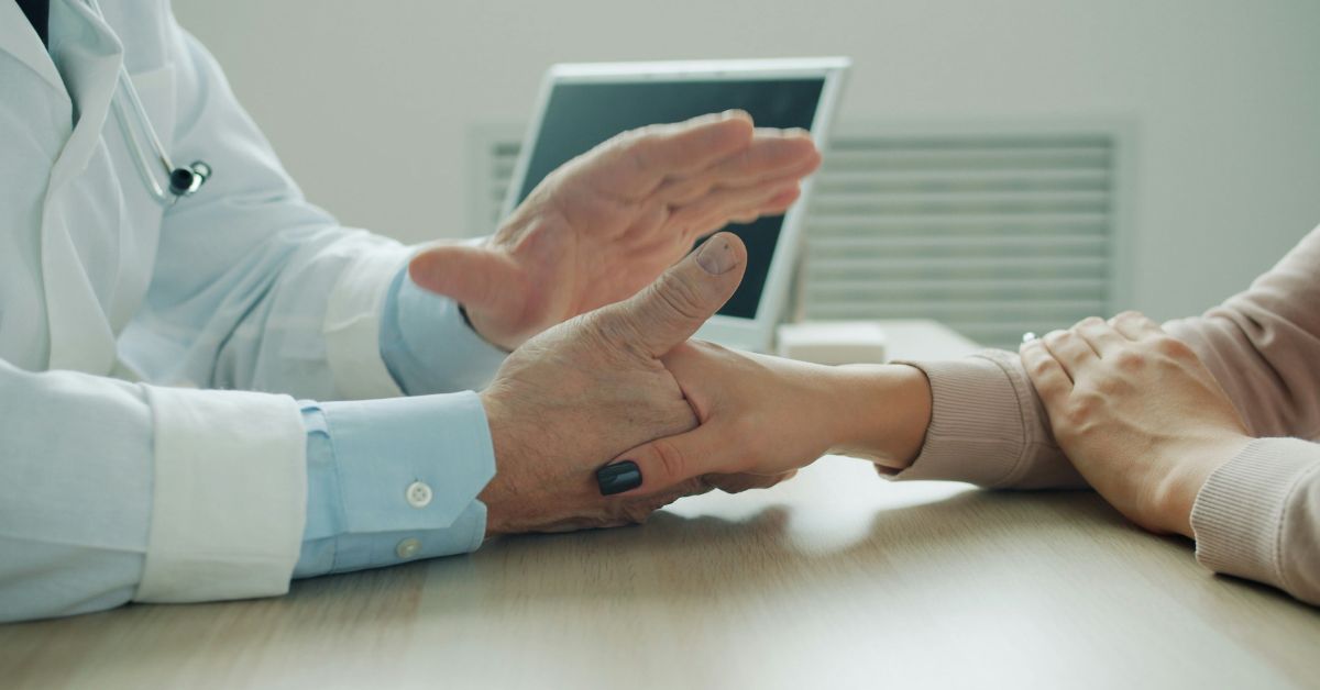 Doctor holding a patients hand