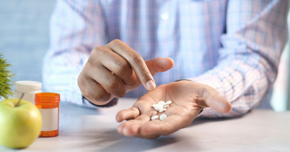 Person with handful of pills