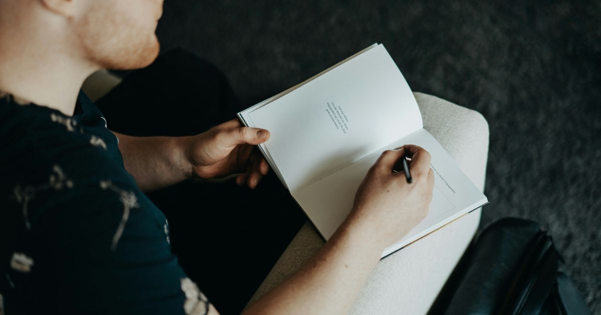 Man writing in a journal